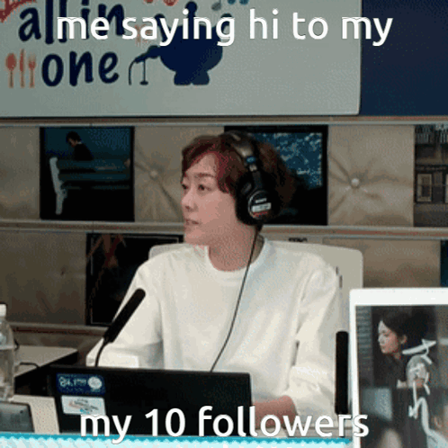 A Woman Wearing Headphones Is Sitting In Front Of A Microphone With The Words " All Me Saying Hi To My 10 Followers " Be GIF