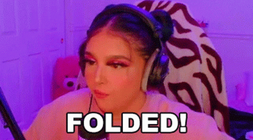 A Woman Wearing Headphones Is Sitting In Front Of A Microphone With The Words Folded Written On Her Face . GIF