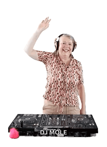A Woman Wearing Headphones Is Standing In Front Of A Dj Mole Machine GIF
