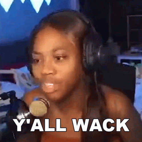 A Woman Wearing Headphones Is Talking Into A Microphone And Says Y 'All Wack GIF