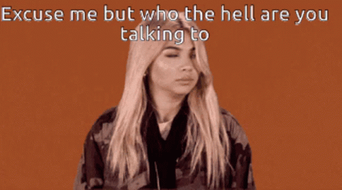 A Woman Wearing Headphones Is Talking To Someone With The Words " Excuse Me But Who The Hell Are You Talking To " GIF