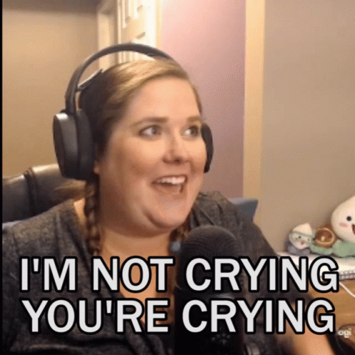 A Woman Wearing Headphones Says " I 'M Not Crying You 'Re Crying " In Front Of A Microphone GIF