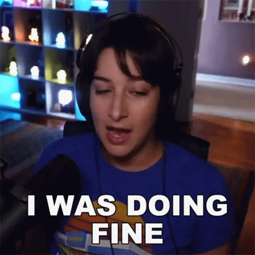 A Woman Wearing Headphones Says " I Was Doing Fine " In Front Of A Microphone GIF