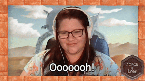 A Woman Wearing Headphones Says Oooooooh In Front Of A Desert Background GIF