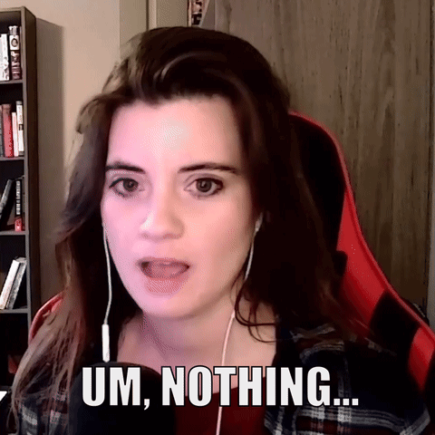 A Woman Wearing Headphones Says Um Nothing In Front Of A Bookshelf GIF