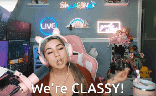 A Woman Wearing Headphones Says We 'Re Classy In Front Of A Live Sign GIF