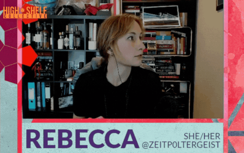 A Woman Wearing Headphones Stands In Front Of A Bookshelf And A Sign That Says Rebecca GIF