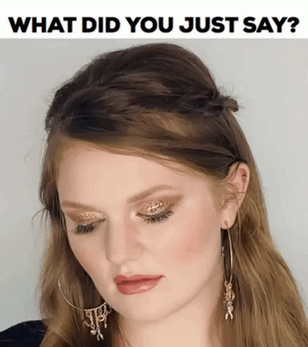 A Woman Wearing Hoop Earrings And A Headband With The Words What Did You Just Say On The Bottom GIF