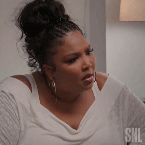 Woman With Hoop Earrings And SNL Shirt GIF