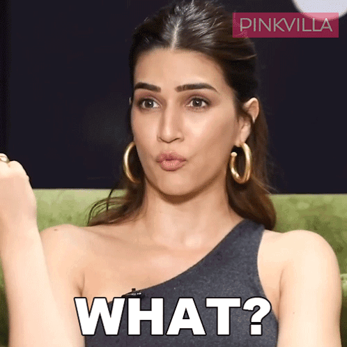 A Woman Wearing Hoop Earrings Is Making A Funny Face And The Word What Is On Her Face GIF