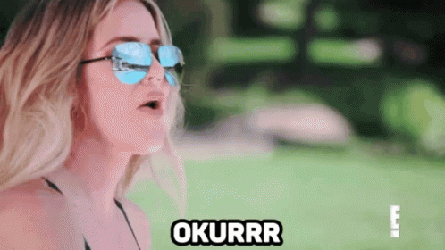 A Woman Wearing Sunglasses And A Bikini Says Okurrr . GIF