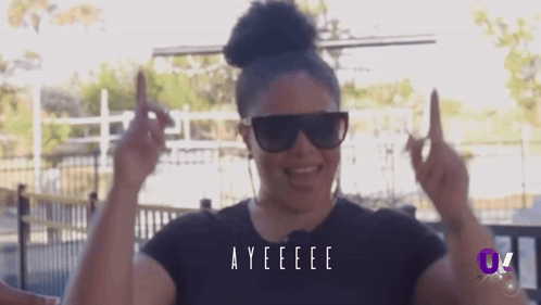A Woman Wearing Sunglasses And A Black Shirt With The Word Ayeeee On It GIF