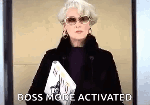 A Woman Wearing Sunglasses And A Fur Coat Is Holding A Newspaper And A Magazine . GIF
