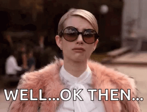 A Woman Wearing Sunglasses And A Fur Coat Is Making A Funny Face And Saying `` Well ... Ok Then ... '' . GIF