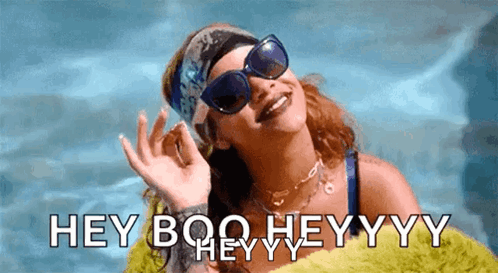A Woman Wearing Sunglasses And A Headband Says " Hey Boo Heyyyy " GIF