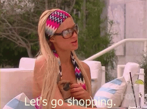 A Woman Wearing Sunglasses And A Headband Says Let 'S Go Shopping . GIF