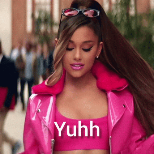 A Woman Wearing Sunglasses And A Pink Jacket With The Word Yuhh On It GIF