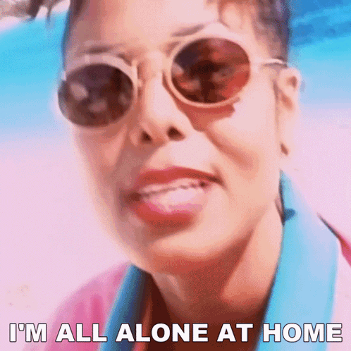 A Woman Wearing Sunglasses And A Pink Shirt Says I 'M All Alone At Home GIF