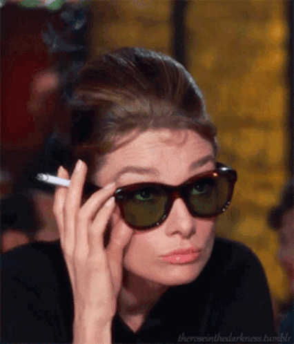 Woman Wearing Sunglasses Holding Cigarette GIF