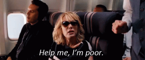 A Woman Wearing Sunglasses Is Sitting On A Plane . GIF