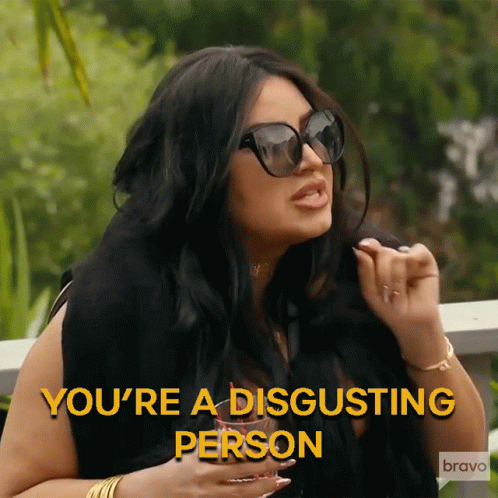 A Woman Wearing Sunglasses Says " You 'Re A Disgusting Person " In Yellow Letters GIF