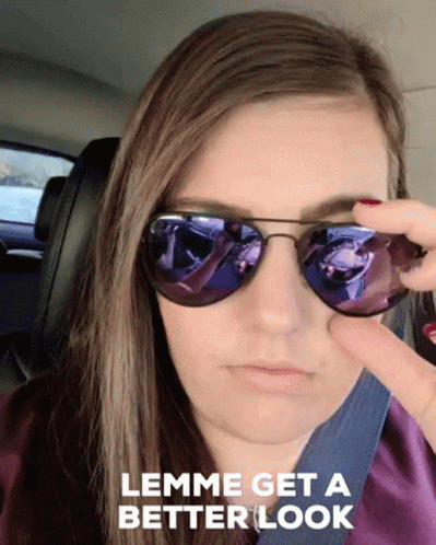 A Woman Wearing Sunglasses With The Words " Lemme Get A Better Look " Below Her GIF