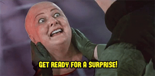 A Woman With A Bald Head Is Being Examined By A Doctor And The Words Get Ready For A Surprise Are Above Her GIF