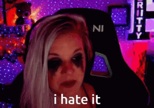 A Woman With A Black Eye Has The Words I Hate It On Her Face . GIF