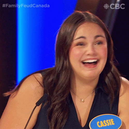 A Woman With A Blue Name Tag That Says Cassie GIF