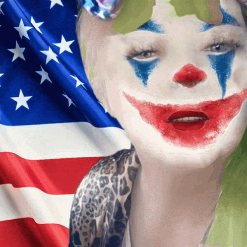 A Woman With A Clown Face Painted On Her Face In Front Of An American Flag GIF