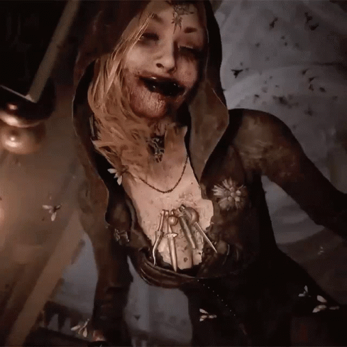 A Woman With A Hood And A Necklace With A Spider On Her Chest GIF