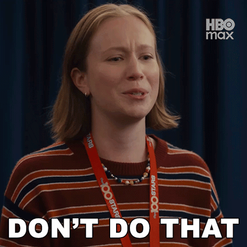 A Woman With A Lanyard Around Her Neck That Says Hbo Max GIF