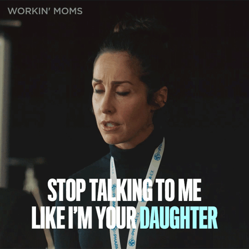 A Woman With A Lanyard That Says Workin ' Moms GIF
