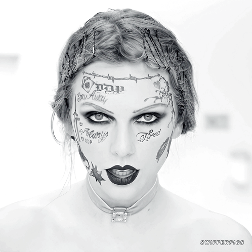 A Woman With A Lot Of Tattoos On Her Face Including One That Says " Tired " GIF