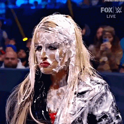A Woman With A Lot Of White Icing On Her Face Is On Fox Live GIF