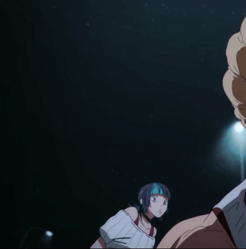 A Woman With A Mask On Her Face Looks At A Man In A Dark Room GIF