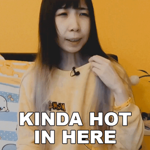 A Woman With A Microphone On Her Neck Says Kinda Hot In Here GIF