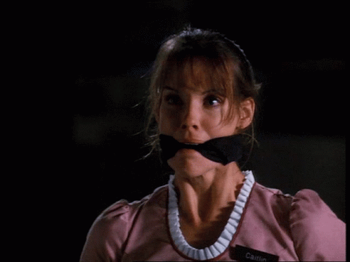 A Woman With A Name Tag That Says Cait GIF