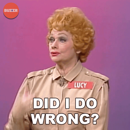 A Woman With A Name Tag That Says Lucy On It GIF