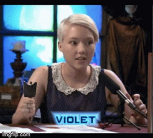 A Woman With A Name Tag That Says Violet Is Holding A Cat GIF