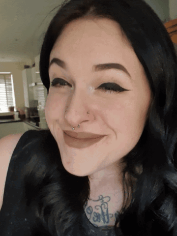 A Woman With A Nose Ring And A Tattoo That Says ' Soft ' GIF