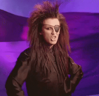 A Woman With A Pirate Eye Patch Is Giving The Middle Finger . GIF
