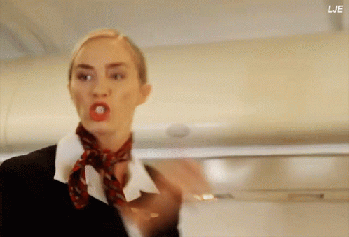 A Woman With A Red Scarf Around Her Neck Has The Letters Lje On The Bottom GIF