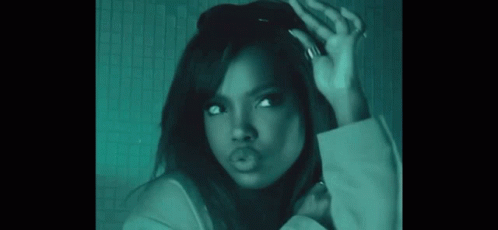 A Woman With A Ring On Her Finger Is Making A Face GIF