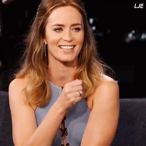 A Woman With A Ring On Her Finger Is Smiling With The Letters Lje In The Corner GIF