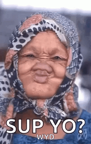 A Woman With A Scarf Around Her Head Is Making A Funny Face . GIF
