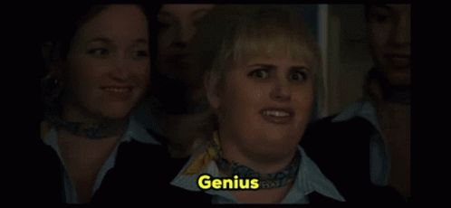 A Woman With A Scarf Around Her Neck And The Word Genius On Her Face GIF