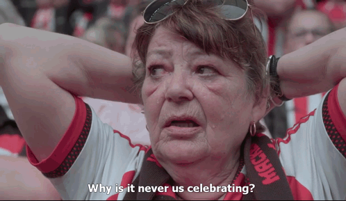 a woman with a scarf that says mack on it is asking why is it never us celebrating