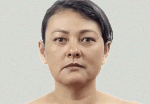 A Woman With A Serious Look On Her Face GIF