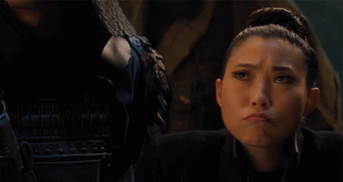 A Woman With A Serious Look On Her Face With The Word Nope Behind Her GIF